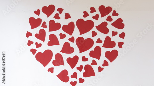 the wall paper with red hart on the wall design for romantic and love concept