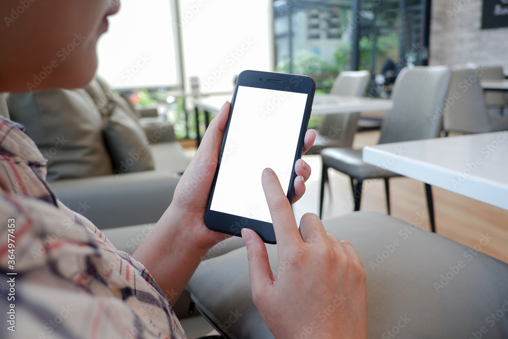 Cropped shot view of woman’s Hands hold the smartphone with blank copy space screen for your information content or text message on the gray granite at the modern place. Cropped shot view of woman’s Hands hold the smartphone with blank copy space screen for your information content or text message on the gray granite at the modern place.