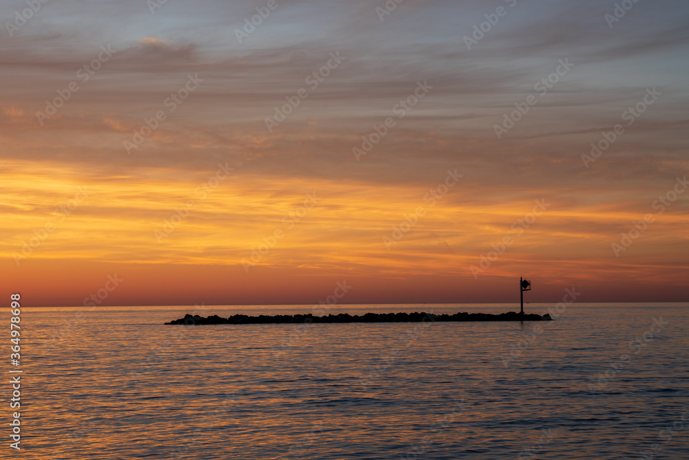 Lake Erie at dawn from East Harbor State Park. Rock jetty protecting a beach in Ohio near Sandusky.