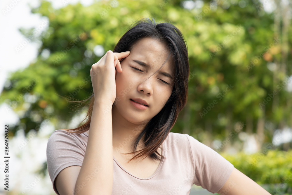 sick asian woman having fever or headache; concept of virus infection, coronavirus COVID-19 flu, vertigo, dizziness, depression, depressed woman, health care medical concept