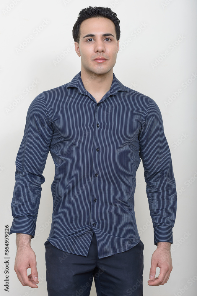 Portrait of young handsome businessman against white background Portrait of young handsome businessman against white background