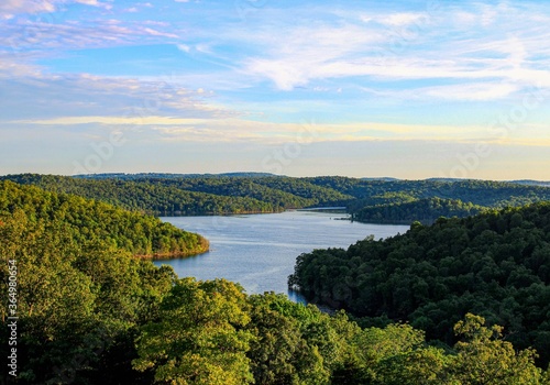 The evening sun shining over Norfork Lake and the surrounding mountains in Mountain Home, Arkansas 