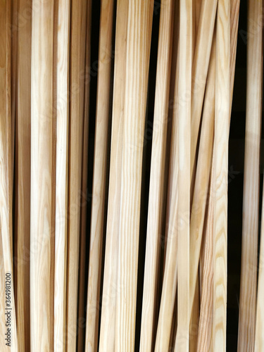 Several sheets of new clean plywood in a stack. Sale of goods for repair and decoration. Wood and texture. Abstract background and shallow depth of field.