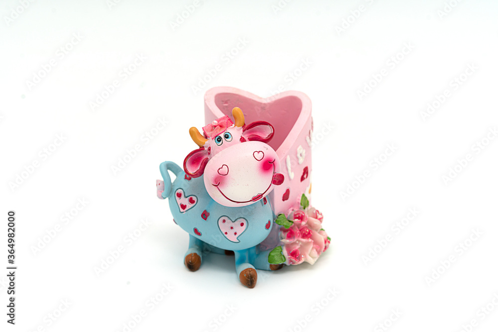 Ceramic toy cow isolated on a white background Ceramic toy cow isolated on a white background