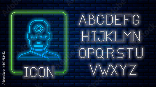 Glowing neon Man with third eye icon isolated on brick wall background. The concept of meditation, vision of energy, aura. Neon light alphabet. Vector Illustration.