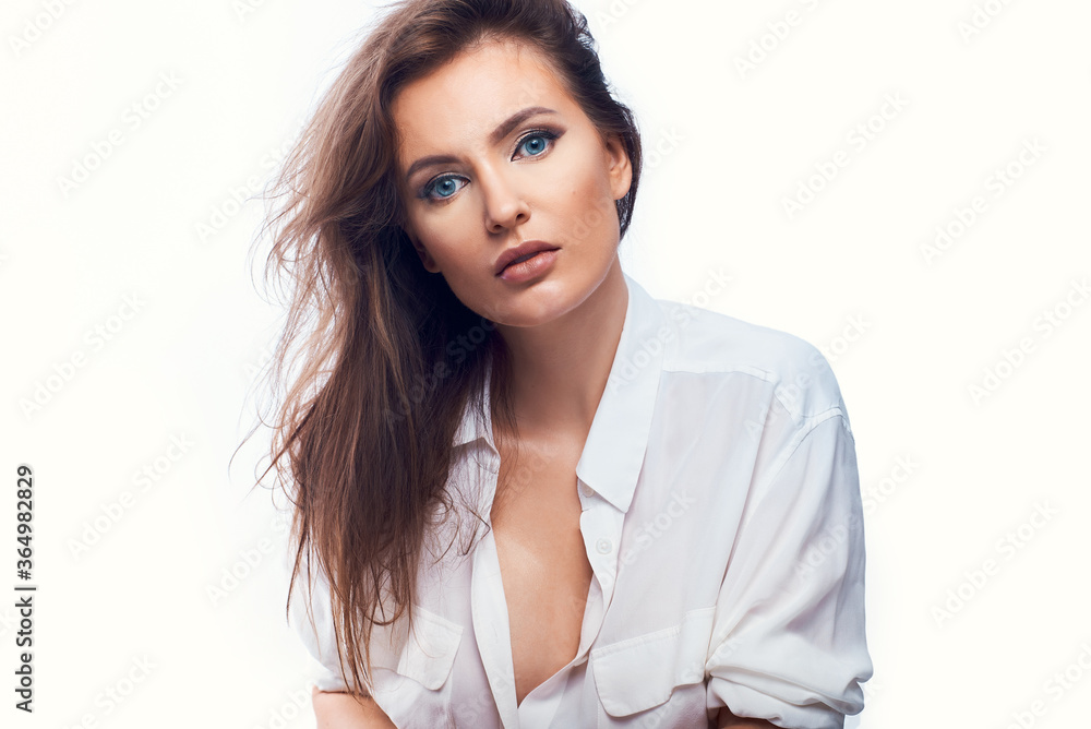 close-up portrait of a beautiful woman on a white background in a light shirt