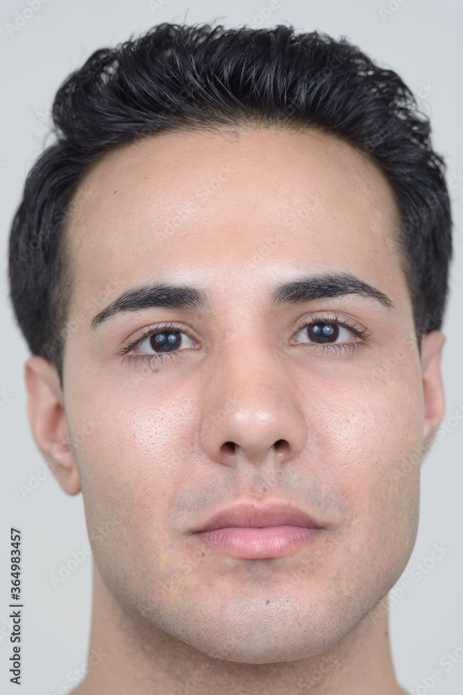 Fototapeta premium Portrait of young handsome man against white background