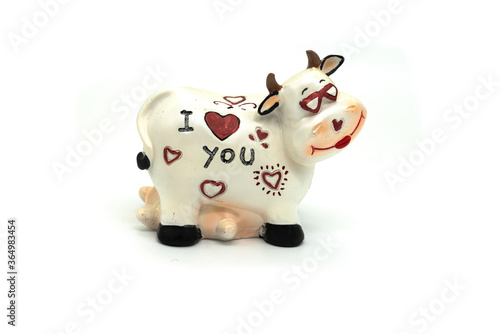 Ceramic toy cow isolated on a white background