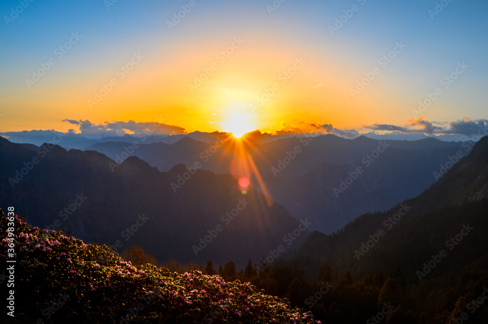 Sunrise in the mountains. Himalayan peaks and alpine landscape from the trail of Sar Pass trek  Himalayan region of Kasol, Himachal Pradesh, India.