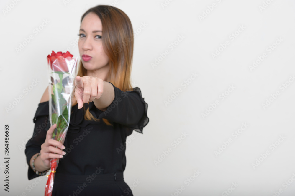 Portrait of young beautiful Asian woman ready for Valentine's day