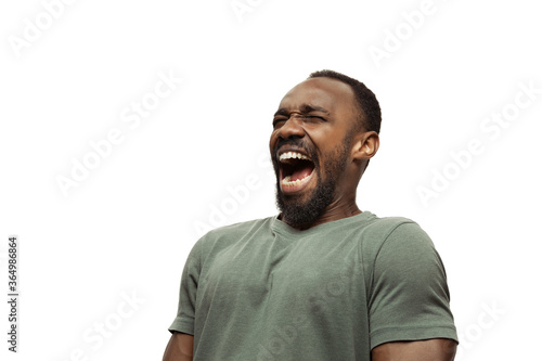 LOL, LMAO. Young african-american man with funny, unusual popular emotions and gestures on white studio background. Human emotions, facial expression, sales, ad concept. Trendy look inspired by memes. photo