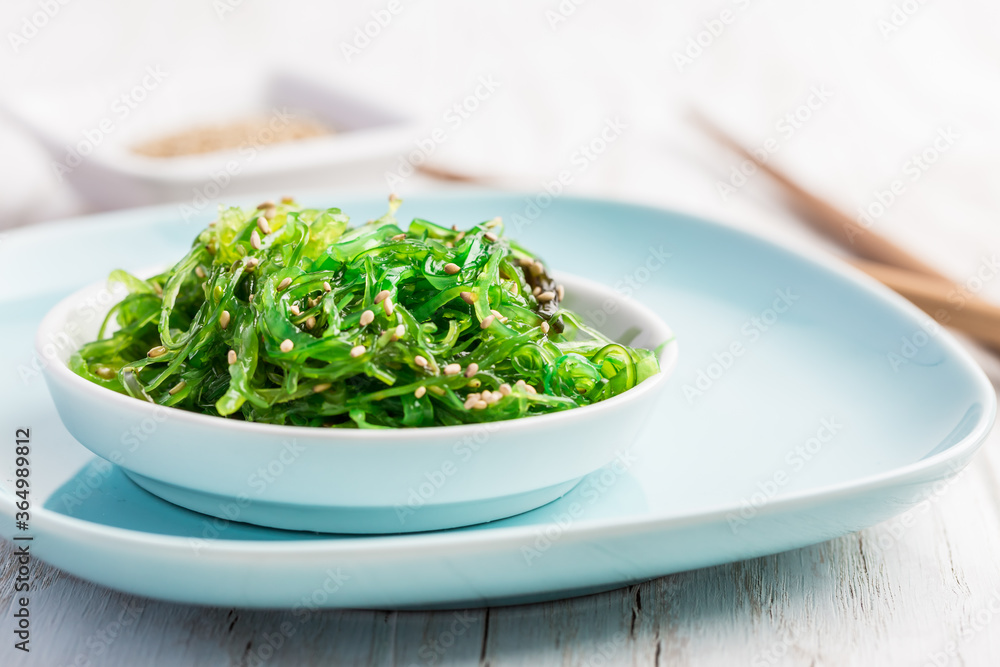 Traditional Japanese wakame salad with sesam seeds. Healthy seaweed salad. Traditional Japanese wakame salad with sesam seeds. Healthy seaweed salad.