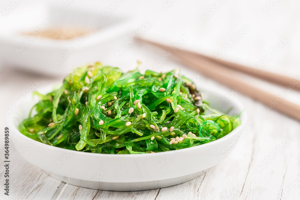 Traditional Japanese wakame salad with sesam seeds. Healthy seaweed salad. Traditional Japanese wakame salad with sesam seeds. Healthy seaweed salad.