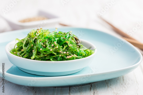 Traditional Japanese wakame salad with sesam seeds. Healthy seaweed salad.