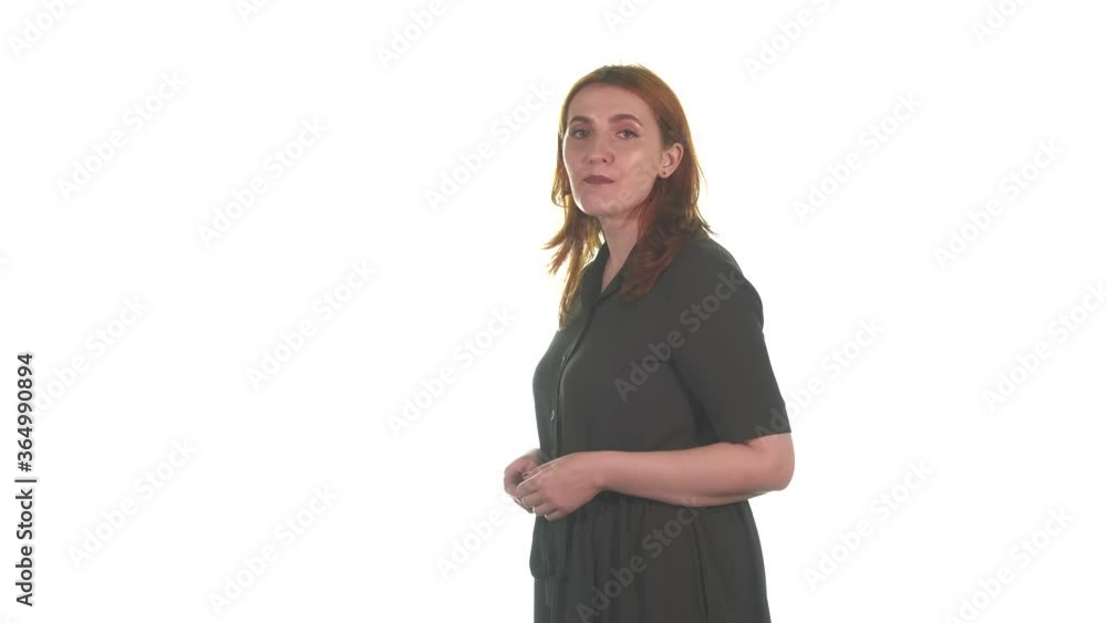 Medium long shot of beautiful young girl with red hair singing and looking at the camera. White background. Isolated Medium long shot of beautiful young girl with red hair singing and looking at the camera. White background. Isolated