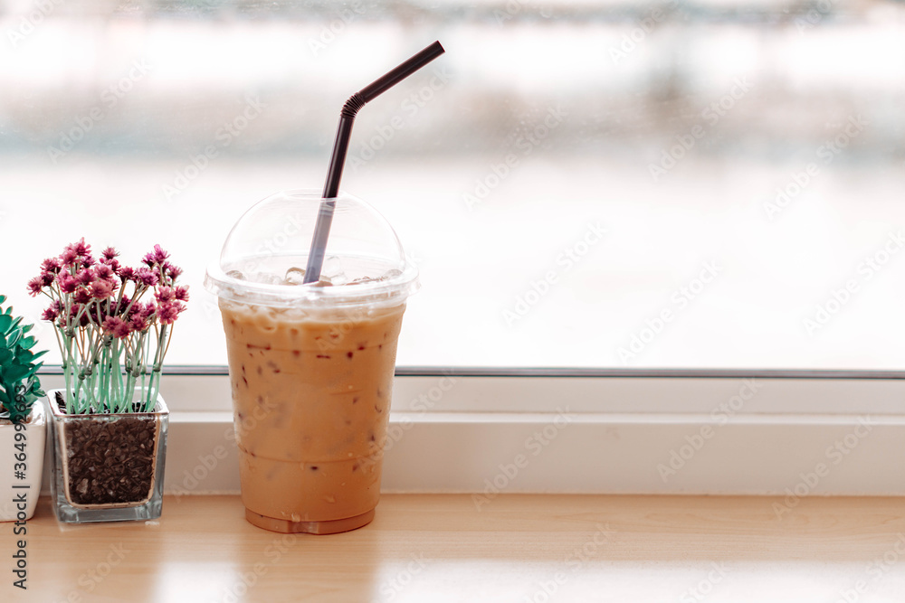 Close up glass of ice americano coffee on wood table, selective focus Close up glass of ice americano coffee on wood table, selective focus