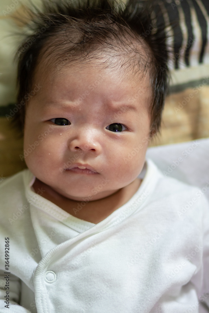 Asia Chinese Baby newborn on the bed, New family and baby healthy concept Asia Chinese Baby newborn on the bed, New family and baby healthy concept