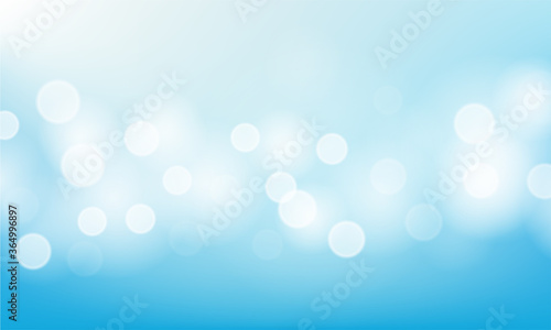 Blurred bright abstract bokeh on blue background