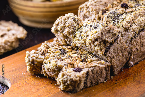 sliced ​​vegan cake, with rolled oats, chia, flaxseed and chestnuts, walnuts and Brazil nuts. Healthy vegetarian dessert without gluten or sugar.