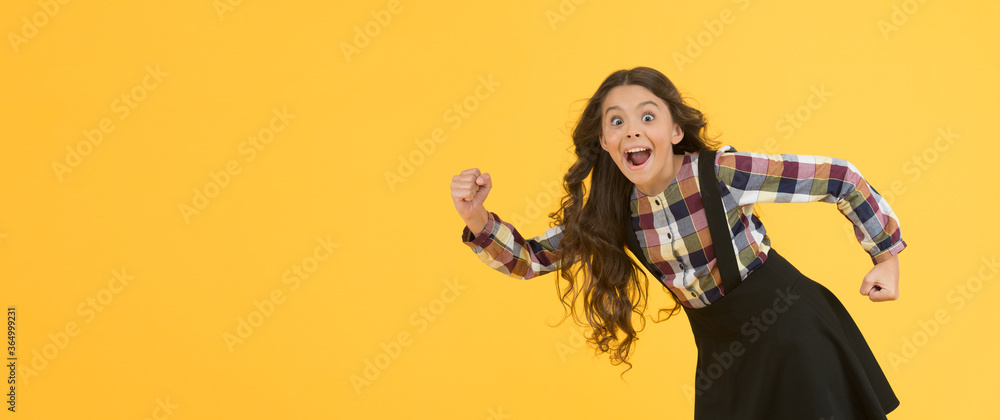 Obraz premium Tips for healthy hair. Towards the wind. Girl kid long hair flying in air. Growing hair. Natural beauty. Extremely effective product. Child with natural beautiful healthy hair yellow background