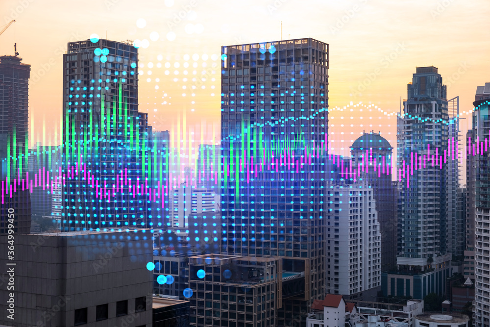 Obraz premium Market behavior graph hologram, sunset panoramic city view of Bangkok, popular location to achieve financial degree in Asia. The concept of financial data analysis. Double exposure.