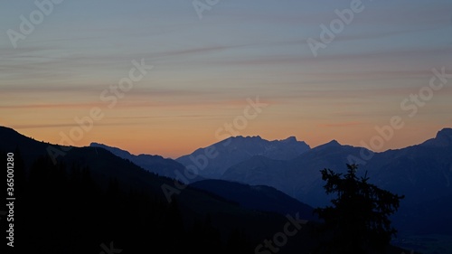 beautiful colorful sunset on the mountains with view to the alps