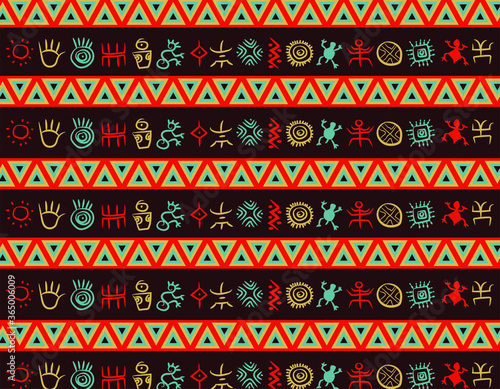 Multicolor geometric native south american indigenous pattern with colorful petroglyphs over a dark violet background