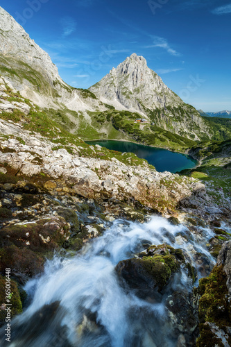 Hiking in european alps at lake drachensee near coburger h  tte hut in ehrwald beautiful mountains and scenery