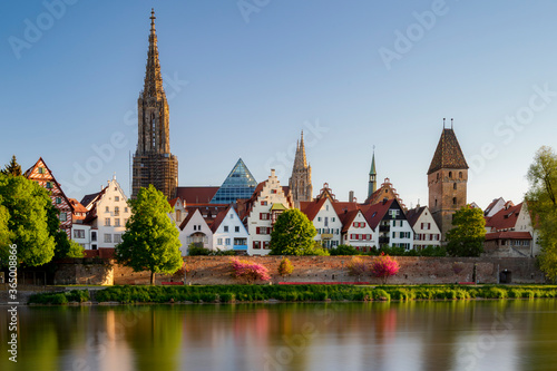 Ulmer minster in the morning at sunrise with reflection in river danube. Ulm 2020 spring
