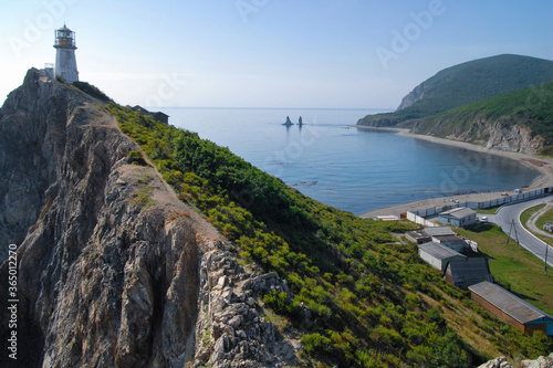 View at Rudny lighthouse and Two Brothers sea stacks (rock, island). Outskirts of Rudnaya Pristan town, Primorsky Krai (Primorye), Far East, Russia. photo