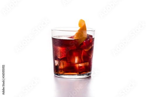 Boulevardier cocktail and orange zest isolated on white background