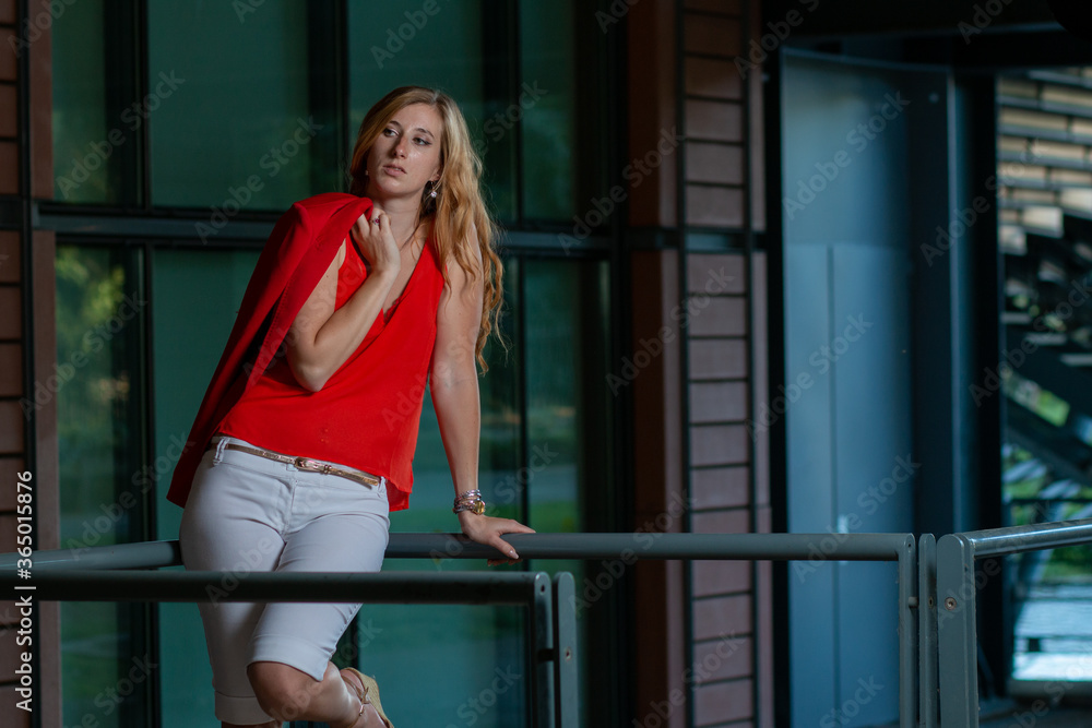 enterprising young woman in red clothes leaving work enterprising young woman in red clothes leaving work