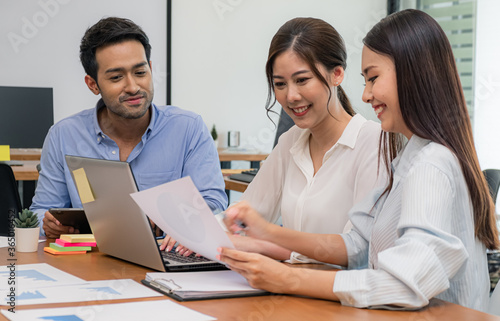 Young business group explaining new business ideas to peers. Business people discussing in meeting room.