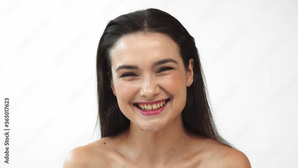 Beautiful naked woman laughing and looking at camera isolated on white Beautiful naked woman laughing and looking at camera isolated on white