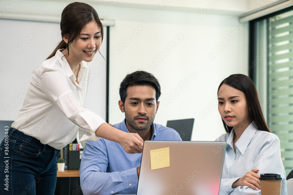 Young business group explaining new business ideas to peers. Business people discussing in meeting room. Young business group explaining new business ideas to peers. Business people discussing in meeting room.
