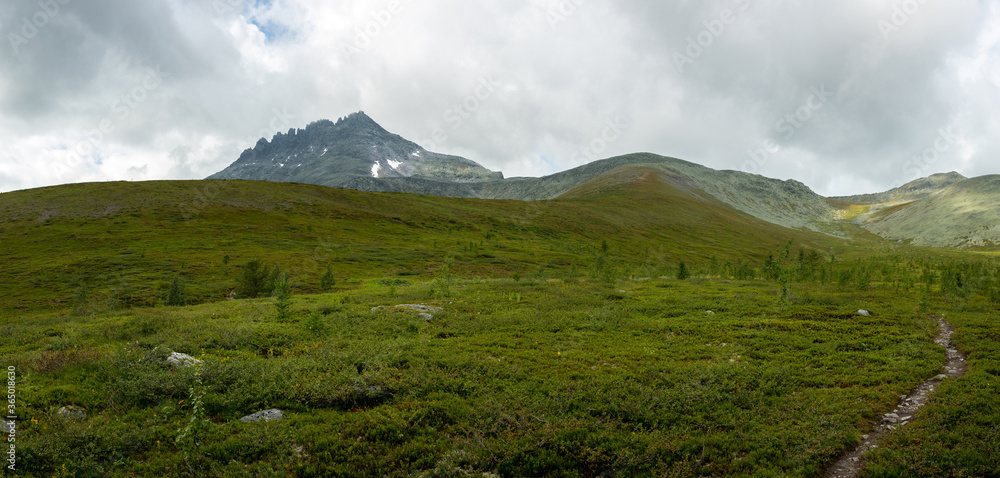 Amazing mountain landscape with colorful sky. Travel and hiking concept. Mountain landscape Subpolar Urals.