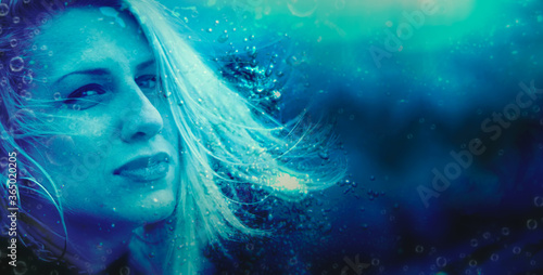 Underwater portrait of a blonde attractive woman
