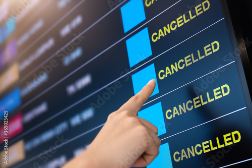 Airport lock down, Flights cancelled on information time table board in airport while coronavirus outbreak pandemic issued around the world