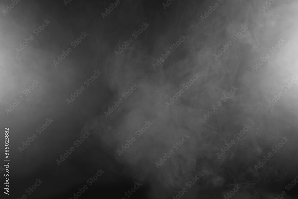 Fototapeta White smoke on a black background. The texture of scattered smoke. Blank for design. Layout for collages.
