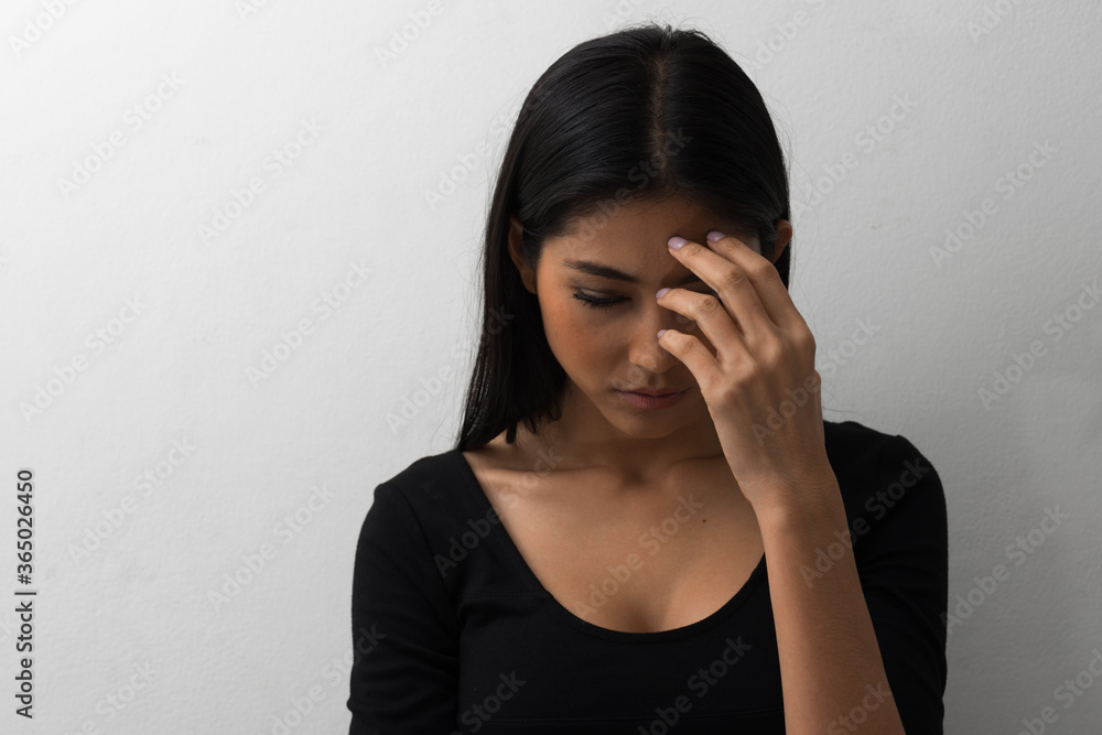 Portrait of young beautiful Asian businesswoman against white background