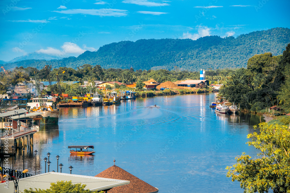 Lawas, Sarawak, Malaysia cityscape with river and mountain background