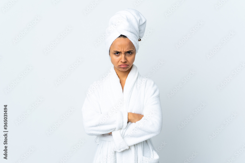 Young woman in bathrobe over isolated white background feeling upset Young woman in bathrobe over isolated white background feeling upset