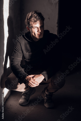 Man in black coat in attic © Ольга Ивлева
