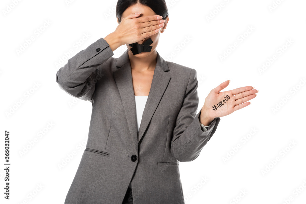 businesswoman with me too lettering on hand and scotch tape on mouth covering eyes isolated on white businesswoman with me too lettering on hand and scotch tape on mouth covering eyes isolated on white