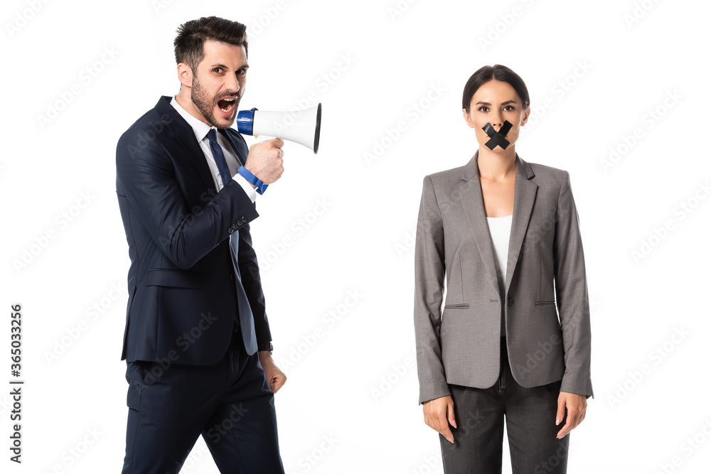 bearded businessman screaming in megaphone near businesswoman with duct tape on mouth isolated on white, gender inequality concept bearded businessman screaming in megaphone near businesswoman with duct tape on mouth isolated on white, gender inequality concept