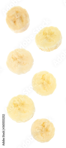 Set with delicious ripe banana pieces falling on white background