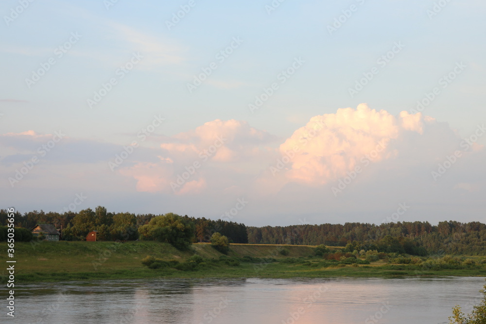 Sunny evening on the river in the countryside