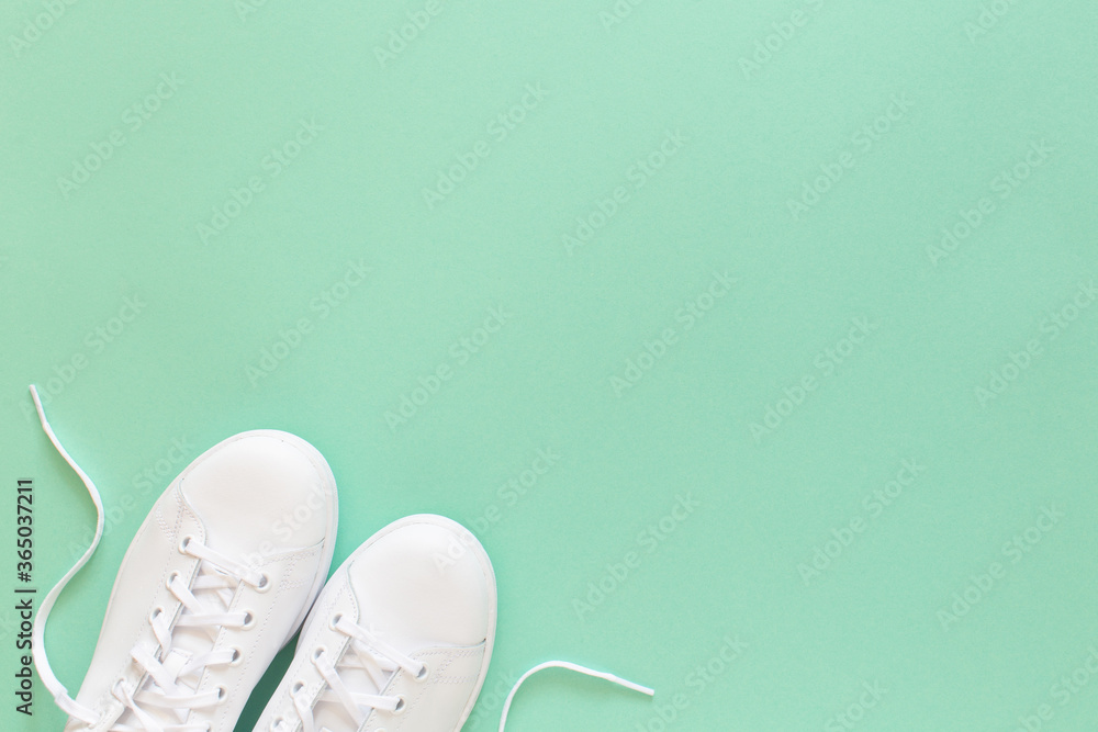 Ταπετσαρία All white sneakers on mint green background. Top view, flat lay