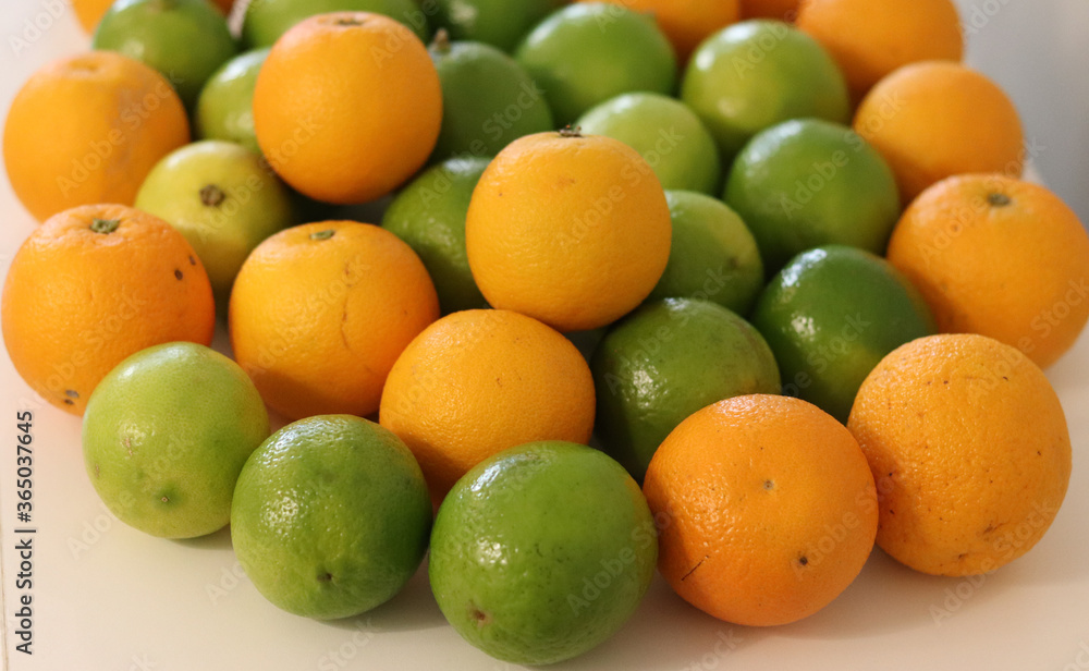 Beautiful lemons and oranges arranged on a table. A fruit rich in vitamin c. Beautiful lemons and oranges arranged on a table. A fruit rich in vitamin c.