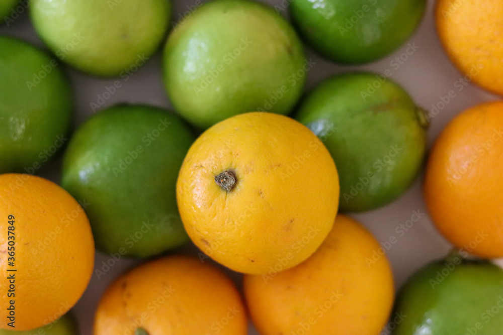 Beautiful lemons and oranges arranged on a table. A fruit rich in vitamin c. Beautiful lemons and oranges arranged on a table. A fruit rich in vitamin c.